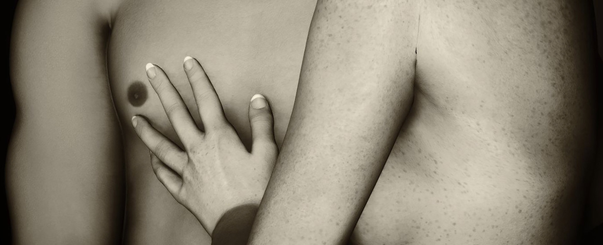 CLose up of woman with hand on man's chest